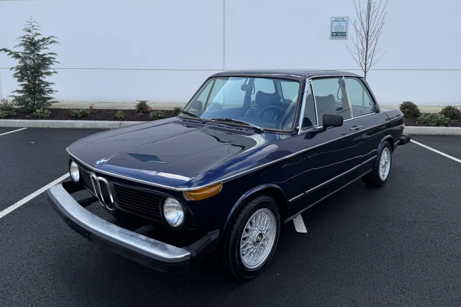 Finished 1974 BMW 2002tii, front three-quarter exterior view in dark blue