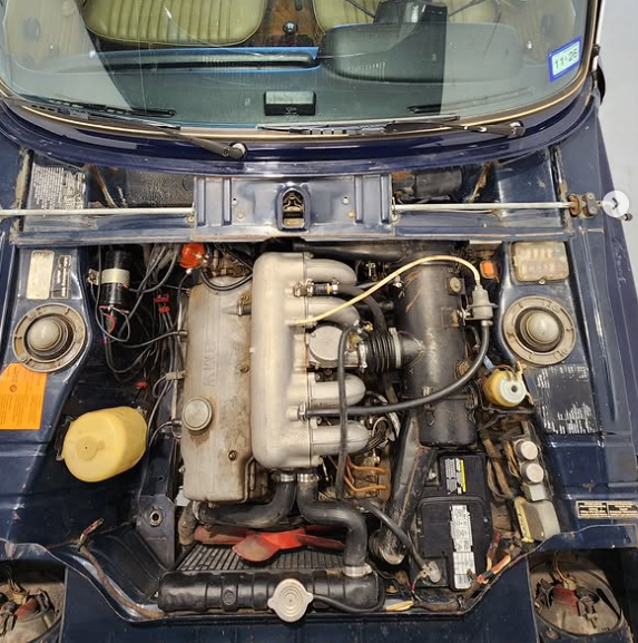 1974 BMW 2002tii engine bay before dry ice cleaning