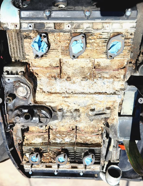 1974 Porsche 911 S air-cooled flat-six magnesium block caked with 31 years of rodent nest debris packed between the cooling fins